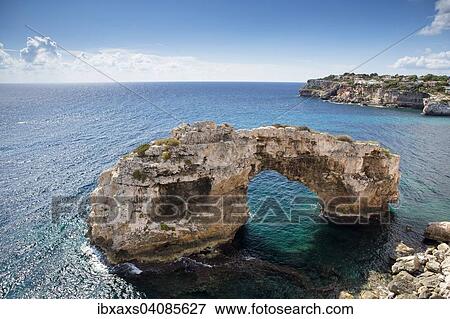 Stock Photo - Natural stone arch in the sea, It Pontas, Santanyi, Majorca, Balearic Islands, Spain, Europe. Fotosearch