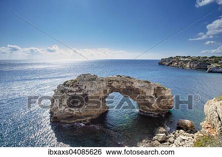 Stock Photograph - Natural stone arch in the sea, It Pontas, Santanyi, Majorca, Balearic Islands, Spain, Europe. Fotosearch
