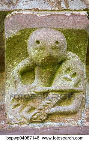 Norman Romanesque exterior corbel no. 44, sculpture of a fiddle or rebeck player, by the Hereford School of Romanesque Stonemasons, Church of St Mary and St David, Kilpeck, Herefordshire, England, United Kingdom, Europe View Large Photo Image Stock Photograph - Norman Romanesque exterior corbel no. 44, sculpture of a fiddle or rebeck player, by the Hereford School of Romanesque Stonemasons, Church of St Mary and St David, Kilpeck, Herefordshire, England, United Kingdom, Europe. Fotosearch