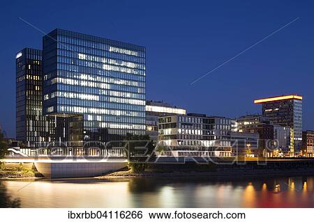 Stock Photograph - Office buildings, commercial buildings and hotels in the Quartier Speditionstrasse in the Medienhafen, Media Harbour, Dusseldorf, Rhineland, North Rhine-Westphalia, Germany, Europe. Fotosearch