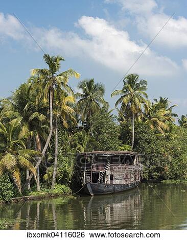 Old boat, palm tree fringed backwaters canal system, Kerala, Malabar Coast, South India, India, Asia View Large Photo Image Stock Photograph - Old boat, palm tree fringed backwaters canal system, Kerala, Malabar Coast, South India, India, Asia. Fotosearch