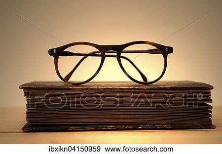 Old book with reading glasses View Large Photo Image Stock Photo - Old book with reading glasses. Fotosearch