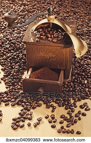 Old coffee grinder, made of wood, circa 1950, on coffee beans View Large Photo Image Stock Image - Old coffee grinder, made of wood, circa 1950, on coffee beans. Fotosearch