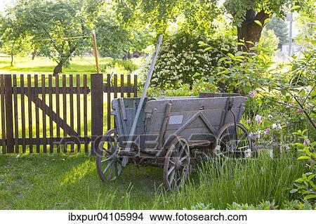 Old wagon in front of a garden gate, Saxony, Germany, Europe View Large Photo Image Picture - Old wagon in front of a garden gate, Saxony, Germany, Europe. Fotosearch