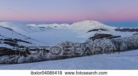 Piano Grande of Castelluccio di Norcia at sunset in winter, Sibillini Mountains National Park, Umbria, Italy, Europe View Large Photo Image Stock Photo - Piano Grande of Castelluccio di Norcia at sunset in winter, Sibillini Mountains National Park, Umbria, Italy, Europe. Fotosearch