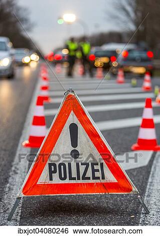 Police warning triangle during a spot check on traffic, Germany, Europe View Large Photo Image Stock Photograph - Police warning triangle during a spot check on traffic, Germany, Europe. Fotosearch