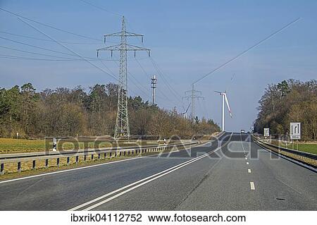 Power line, wind turbine, road, near Bad Kissingen, Bavaria, Germany, Europe View Large Photo Image Stock Image - Power line, wind turbine, road, near Bad Kissingen, Bavaria, Germany, Europe. Fotosearch