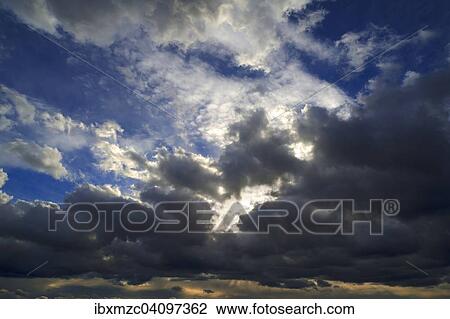 Stock Image - Rain clouds (Nimbostratus) sky clearing, Germany, Europe. Fotosearch