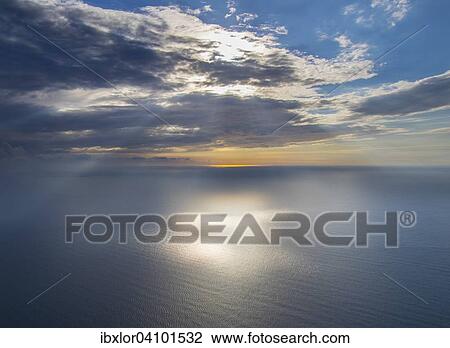 Stock Image - Rays of light in the clouds on the sea, Conero, Marche, Italy, Europe. Fotosearch