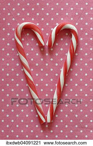 Red and white candy canes forming heart shape View Large Photo Image Stock Image - Red and white candy canes forming heart shape. Fotosearch