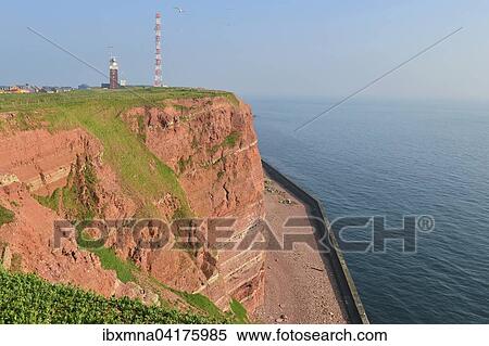 Red cliffs, lighthouse, transmission tower and North Sea, Heligoland, Schleswig-Holstein, Germany, Europe View Large Photo Image Stock Photography - Red cliffs, lighthouse, transmission tower and North Sea, Heligoland, Schleswig-Holstein, Germany, Europe. Fotosearch