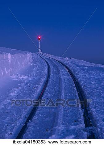 Red signal light on snow-covered tracks of the Brocken railway, Brocken, Harz, Saxony-Anhalt, Germany, Europe View Large Photo Image Stock Image - Red signal light on snow-covered tracks of the Brocken railway, Brocken, Harz, Saxony-Anhalt, Germany, Europe. Fotosearch