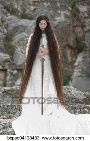 Reminiscence to Joan of Arc, Jeanne d'Arc, young woman in a white dress with a sword View Large Photo Image Stock Image - Reminiscence to Joan of Arc, Jeanne d'Arc, young woman in a white dress with a sword. Fotosearch