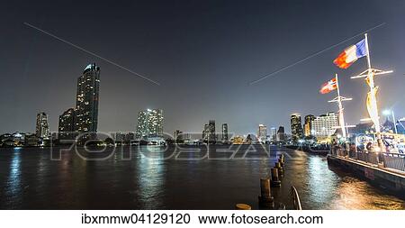 River promenade in the evening with a Ferris wheel and the skyline on the river Mae Nam Chao Phraya, Asiatique, Bangkok, Thailand, Asia View Large Photo Image Stock Image - River promenade in the evening with a Ferris wheel and the skyline on the river Mae Nam Chao Phraya, Asiatique, Bangkok, Thailand, Asia. Fotosearch