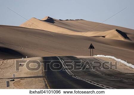 Road B2 between Swakopmund and Walvis Bay, sand dunes at the back, Namibia, Africa View Large Photo Image Stock Photograph - Road B2 between Swakopmund and Walvis Bay, sand dunes at the back, Namibia, Africa. Fotosearch