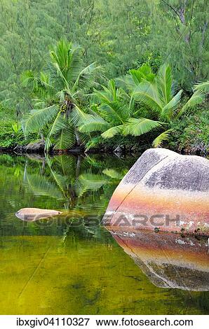 Stock Photo - Rocks in the lagoon, near Anse Lazio, Praslin, Seychelles, Africa. Fotosearch
