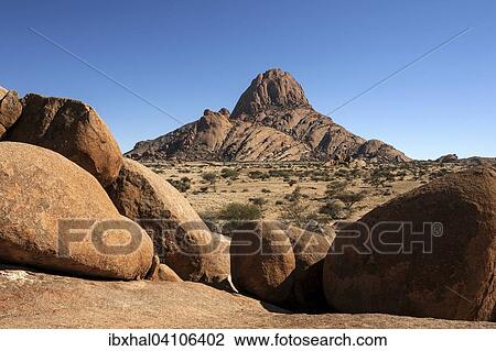 Rocks in the Spitzkoppe area, Great Spitzkoppe behind, Damaraland, Namibia, Africa View Large Photo Image Stock Image - Rocks in the Spitzkoppe area, Great Spitzkoppe behind, Damaraland, Namibia, Africa. Fotosearch