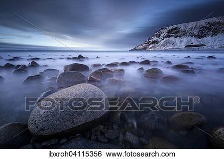 Stock Photograph - Rocks on the beach of Unstad, Lofoten, Norway, Europe. Fotosearch