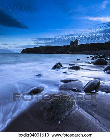 Round stones on Minard Beach, Minard Castle at the back, Minard Head, Dingle Bay, Dingle Peninsula, County Kerry, Ireland, Europe View Large Photo Image Stock Image - Round stones on Minard Beach, Minard Castle at the back, Minard Head, Dingle Bay, Dingle Peninsula, County Kerry, Ireland, Europe. Fotosearch