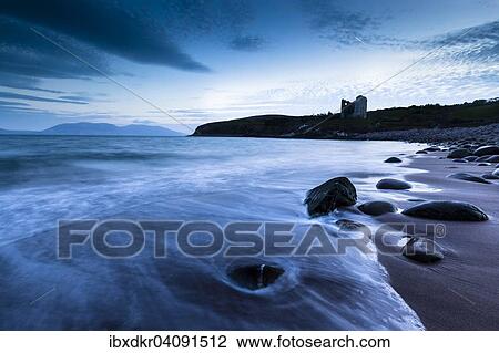 Round stones on Minard Beach, Minard Castle at the back, Minard Head, Dingle Bay, Dingle Peninsula, County Kerry, Ireland, Europe View Large Photo Image Stock Image - Round stones on Minard Beach, Minard Castle at the back, Minard Head, Dingle Bay, Dingle Peninsula, County Kerry, Ireland, Europe. Fotosearch