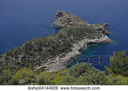 Stock Photo - Sa Foradada peninsula with rock hole, between Deia and Valldemossa, Majorca, Balearic Islands, Spain, Europe. Fotosearch