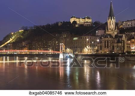 Saint Georges Footbridge and Saint John Cathedral at night, Lyon, Rhone-Alpes, France, Europe View Large Photo Image Stock Photograph - Saint Georges Footbridge and Saint John Cathedral at night, Lyon, Rhone-Alpes, France, Europe. Fotosearch