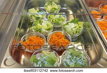 Stock Image - Salads in a school canteen. Fotosearch
