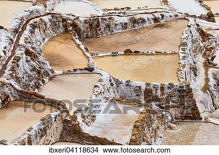 Salt pans in the Sacred Valley of the Incas on the Urubamba, at Maras, Peru, South America View Large Photo Image Picture - Salt pans in the Sacred Valley of the Incas on the Urubamba, at Maras, Peru, South America. Fotosearch