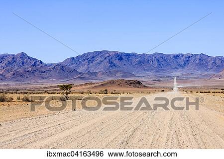 Sand road C27, Nubib Mountains behind, NamibRand Nature Reserve, Namibia, Africa View Large Photo Image Stock Photograph - Sand road C27, Nubib Mountains behind, NamibRand Nature Reserve, Namibia, Africa. Fotosearch
