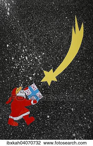 Stock Image - Santa Claus, Christmas presents, Star of Bethlehem, illustration. Fotosearch
