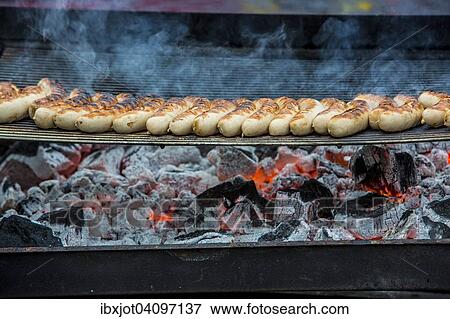 Sausages on charcoal grill View Large Photo Image Stock Photo - Sausages on charcoal grill. Fotosearch