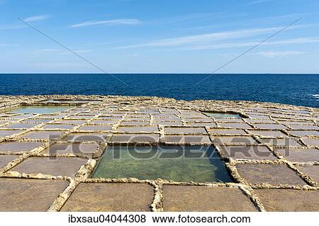 Sea salt extraction in salt pans, Xwejni Bay, Gozo, Malta, Europe View Large Photo Image Stock Photo - Sea salt extraction in salt pans, Xwejni Bay, Gozo, Malta, Europe. Fotosearch