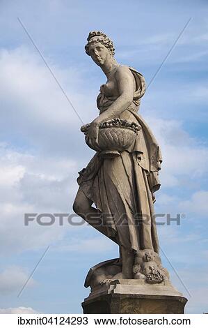 Stock Image - Seasons statue on Ponte Santa Trinita bridge spanning the river Arno, Florence, Tuscany, Italy, Europe. Fotosearch