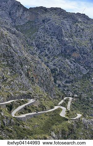 Stock Image - Serpentine road in the bay of Sa Calobra, Majorca, Balearic Islands, Spain, Europe. Fotosearch