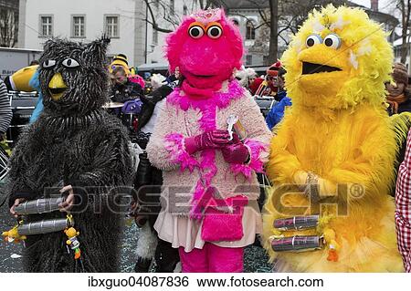 Sesame Street characters, costumes of Guggenmusig Fodlitatscher, traditional carnival celebrations in Lucerne, Switzerland, Europe View Large Photo Image Stock Photograph - Sesame Street characters, costumes of Guggenmusig Fodlitatscher, traditional carnival celebrations in Lucerne, Switzerland, Europe. Fotosearch