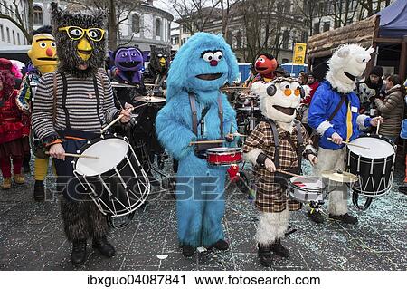 Sesame street characters with the Cookie Monster, costumes of Guggenmusig Fodlitatscher, traditional carnival celebrations in Lucerne, Switzerland, Europe View Large Photo Image Stock Image - Sesame street characters with the Cookie Monster, costumes of Guggenmusig Fodlitatscher, traditional carnival celebrations in Lucerne, Switzerland, Europe. Fotosearch