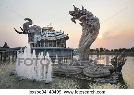 Seven-headed Naga serpent and fountain in front of the Elephant Temple Thep Wittayakhom Vihara, Wittayakom, dusk, Wat Baan Rai, Korat, Nakhon Ratchasima Province, Isaan, Isan, Thailand, Asia View Large Photo Image Stock Photo - Seven-headed Naga serpent and fountain in front of the Elephant Temple Thep Wittayakhom Vihara, Wittayakom, dusk, Wat Baan Rai, Korat, Nakhon Ratchasima Province, Isaan, Isan, Thailand, Asia. Fotosearch