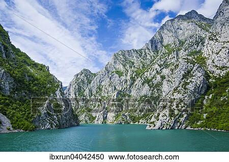 Sheer cliffs in the Koman water reservoir, Balkan, Albania, Europe View Large Photo Image Stock Image - Sheer cliffs in the Koman water reservoir, Balkan, Albania, Europe. Fotosearch