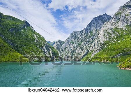Sheer cliffs in the Koman water reservoir, Balkan, Albania, Europe View Large Photo Image Stock Image - Sheer cliffs in the Koman water reservoir, Balkan, Albania, Europe. Fotosearch