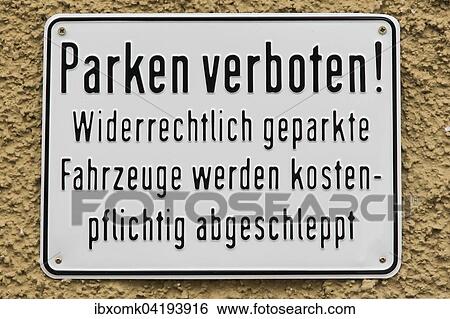 Stock Photograph - Sign in German, on a house wall, parking prohibited, Germany, Europe. Fotosearch