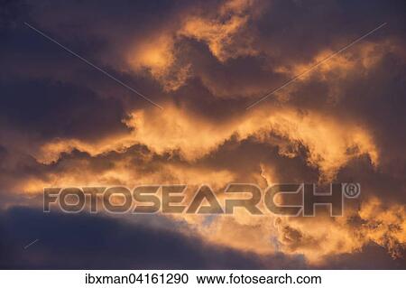 Sky with illuminated clouds at sunset View Large Photo Image Stock Image - Sky with illuminated clouds at sunset. Fotosearch