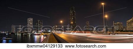 Stock Image - Skyline, Bridge over the river Mae Nam Chao Phraya, at night, Bangkok, Thailand, Asia. Fotosearch