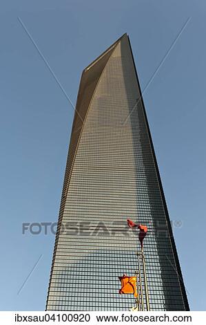 Stock Image - Skyscraper, SWFC Shanghai World Financial Center with Chinese flags, Pudong, Shanghai, China, Asia. Fotosearch