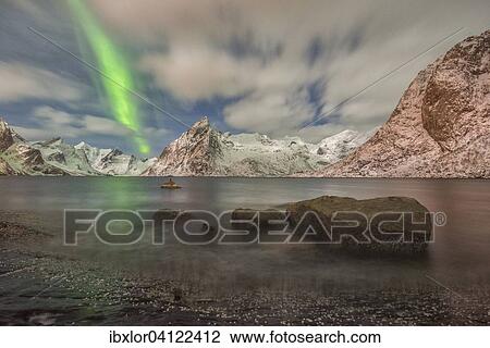 Small aurora with clouds, rocks by the ocean, mountains at the back, Hamnoy Island, Lofoten, Norway, Europe View Large Photo Image Stock Image - Small aurora with clouds, rocks by the ocean, mountains at the back, Hamnoy Island, Lofoten, Norway, Europe. Fotosearch