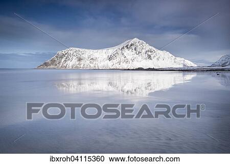 Stock Image - Snowy mountains, Skagsanden, Flakstad, Flakstadsoya, Lofoten, Norway, Europe. Fotosearch