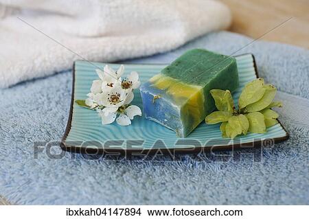Picture - Soap piece with flowers, terry towels. Fotosearch