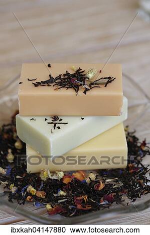 Stock Image - Soap pieces with dried flowers. Fotosearch