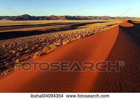 Southern foothills of the Namib desert, sand dunes, behind the Tiras Mountains, evening light, Namibia, Africa View Large Photo Image Picture - Southern foothills of the Namib desert, sand dunes, behind the Tiras Mountains, evening light, Namibia, Africa. Fotosearch