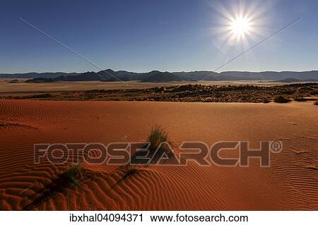 Southern foothills of the Namib desert, sand dunes, behind the Tiras Mountains, backlit, morning light, Namibia, Africa View Large Photo Image Stock Image - Southern foothills of the Namib desert, sand dunes, behind the Tiras Mountains, backlit, morning light, Namibia, Africa. Fotosearch