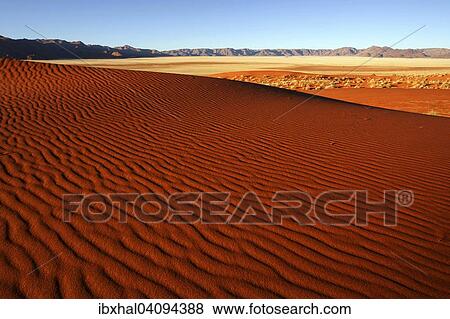 Southern foothills of the Namib desert, sand dunes, structures, behind the Tiras Mountains, evening light, Namibia, Africa View Large Photo Image Stock Photo - Southern foothills of the Namib desert, sand dunes, structures, behind the Tiras Mountains, evening light, Namibia, Africa. Fotosearch